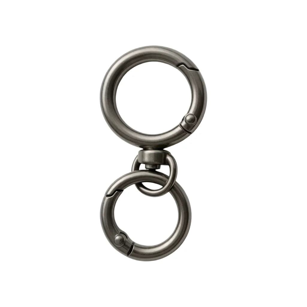A close-up view of a round, silver metal snap hook with a swivel design.