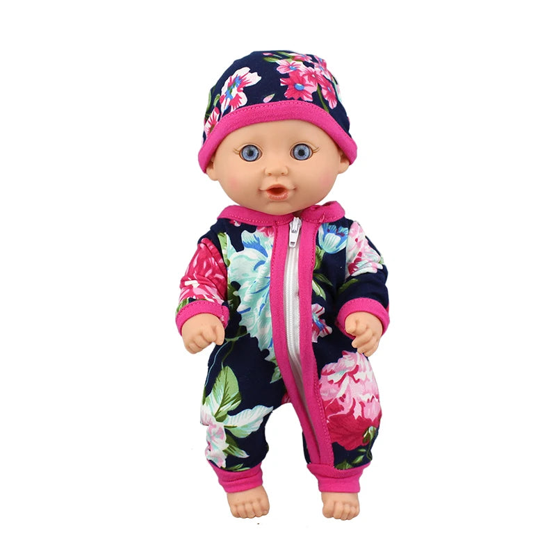 A baby doll wearing a floral print jumpsuit and matching hat.