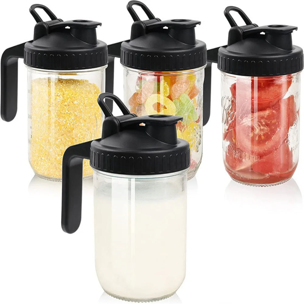 A set of wide mouth mason jars with black lids and pour spouts filled with various colorful fruits and ingredients.