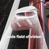 A clear, wide-angle car blind spot mirror is shown mounted on a vehicle's exterior.