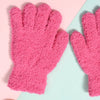 A pair of bright pink, fuzzy plush winter gloves for kids displayed against a light background.