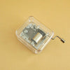 A clear plastic box containing DIY parts for a Montessori busy board activity.