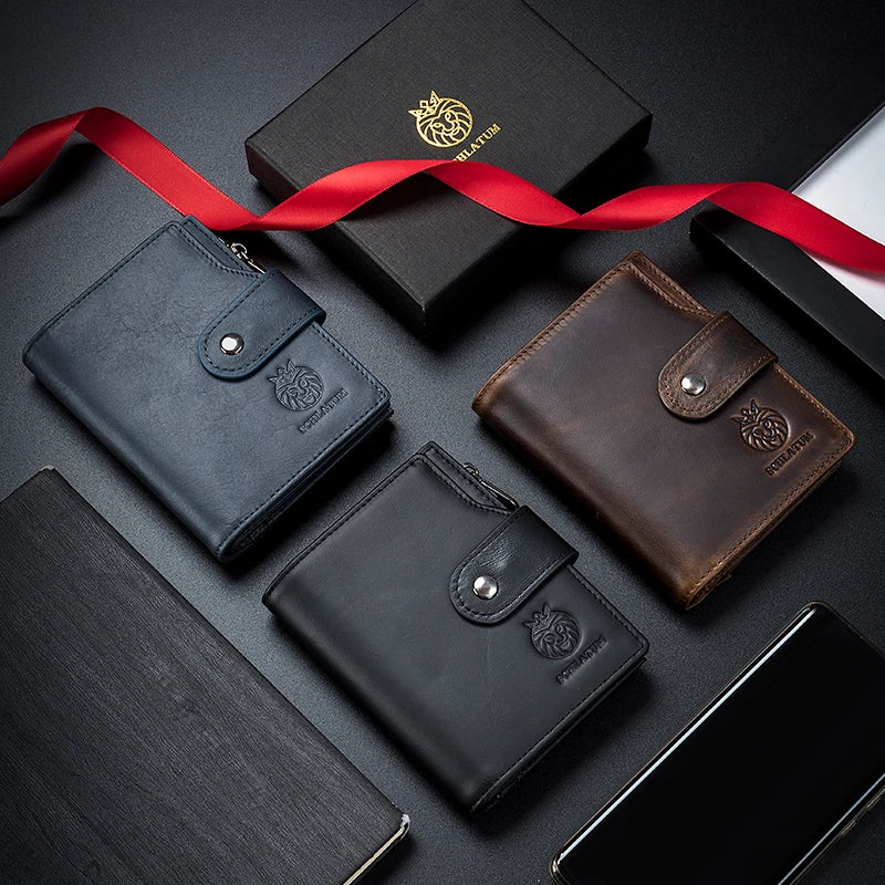 A collection of black and brown genuine leather wallets and a red ribbon on a dark surface.