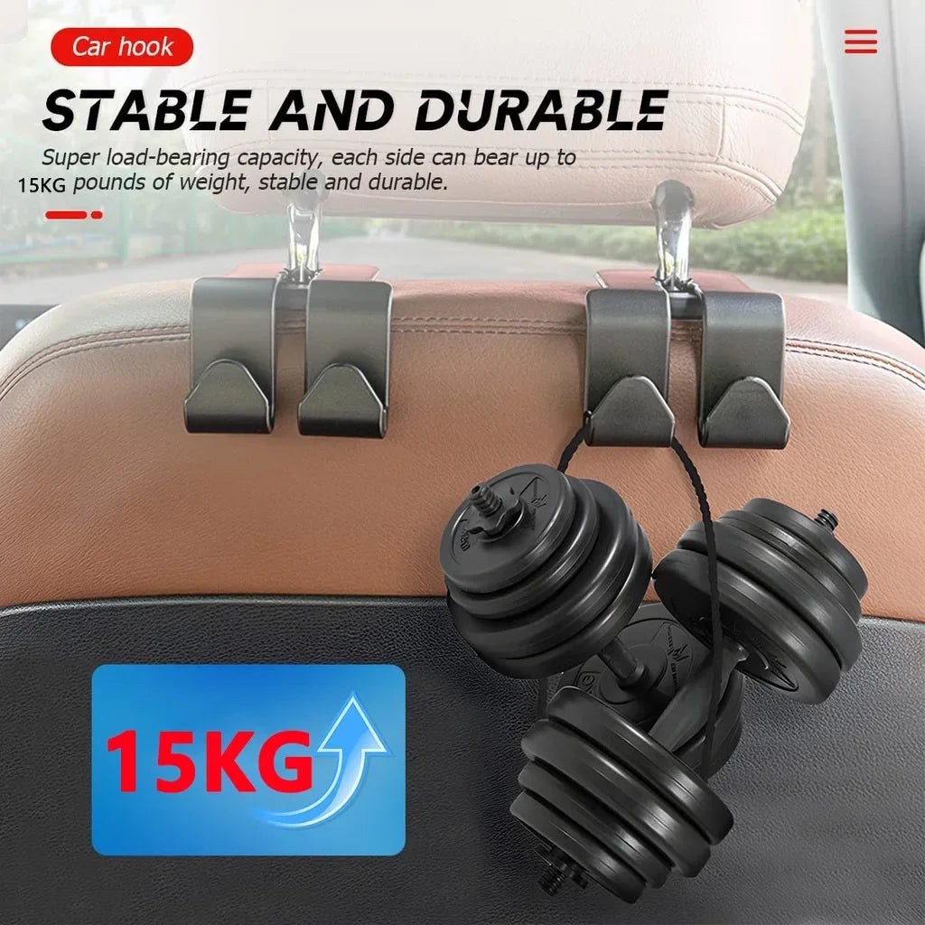 Two black car hook attachments are shown securing a set of dumbbells onto a car headrest.