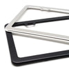 A set of two stainless steel license plate frames, one silver and one black, displayed against a white background.