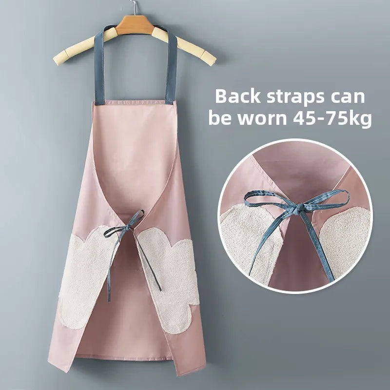 Pink waterproof kitchen apron with adjustable back straps shown on a hanger and a close-up detail.