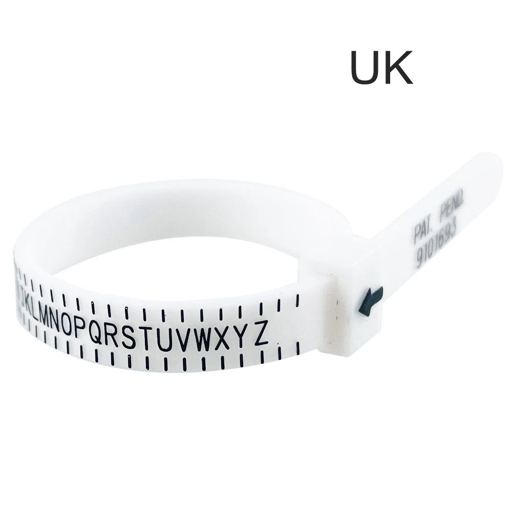 A white adjustable ring and bracelet sizer measuring tool with a letter scale and UK marking.
