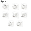 A set of four self-adhesive curtain rod hooks for hanging curtains.