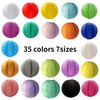 A collection of 35 round paper lanterns in various colors and sizes.