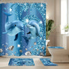 A set of blue dolphin bathroom accessories featuring a shower curtain and floor mats.