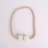 A set of eight elegant pearl magnetic curtain tie-back clips on a delicate beaded chain.