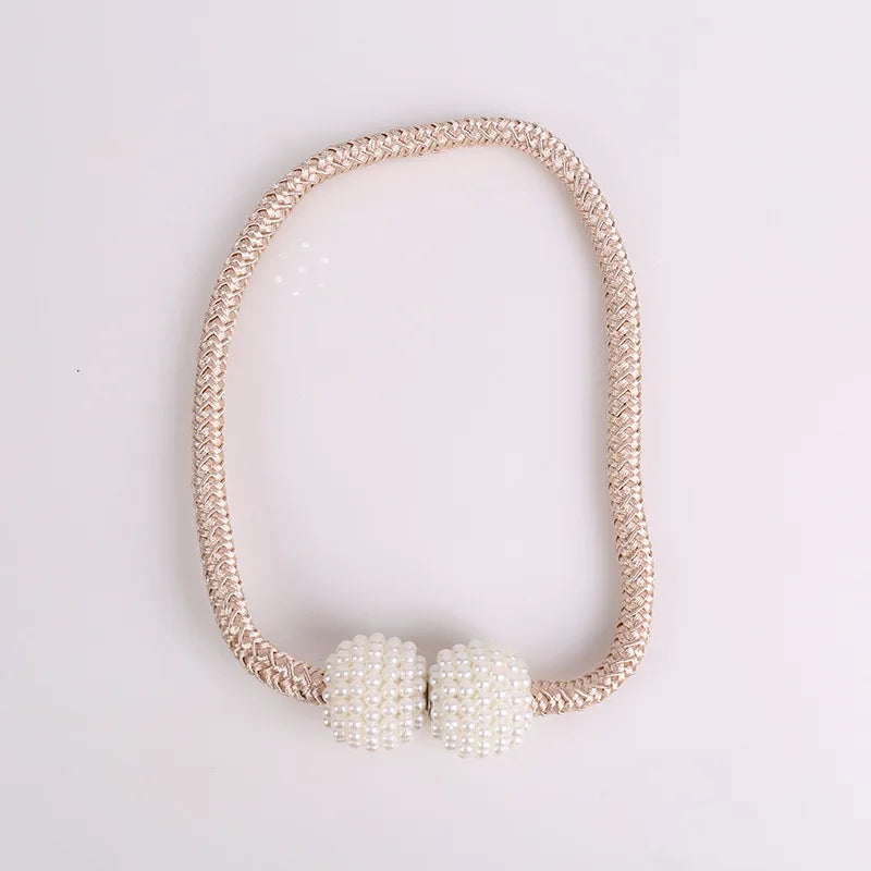 A set of eight elegant pearl magnetic curtain tie-back clips on a delicate beaded chain.