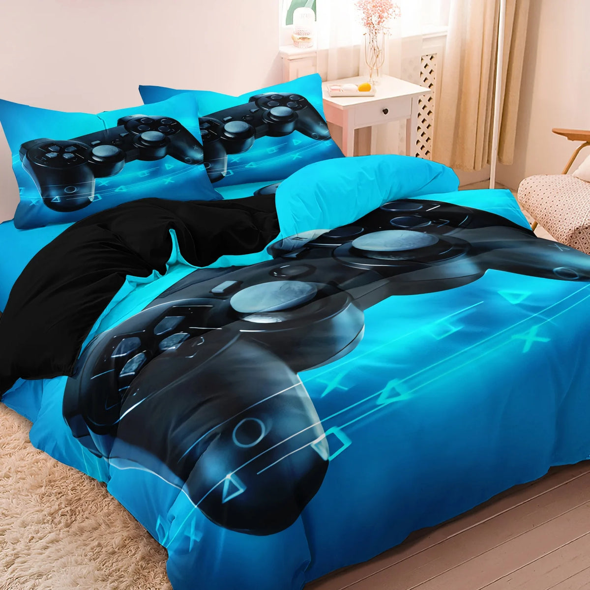 A blue duvet cover featuring a graphic print of a black gaming controller and keyboard on the fabric.