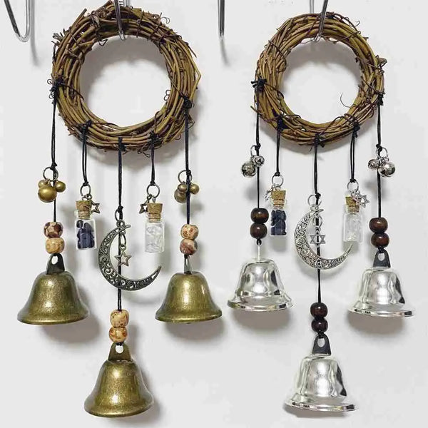 A set of witch bells door hangers and wind chimes made of natural wood and glass hanging from a rack.