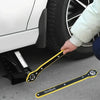 A yellow and black NewShark labor-saving ratchet wrench is shown being used on a car tire.