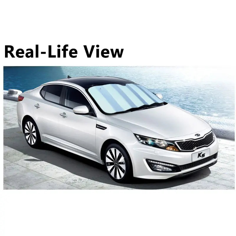 A white Kia sedan with black roof showing real-life view of foldable car windshield sun visors.