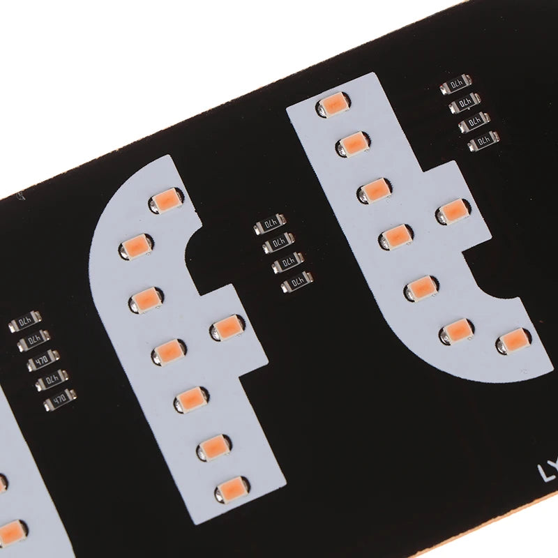 A black circuit board with multiple LED lights mounted on it.