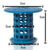 A blue flexible hair catcher drain cover with a slotted cylindrical design and a flat top and bottom.