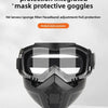A black protective mask featuring a patterned lens and integrated eye protection for face and eye safety.