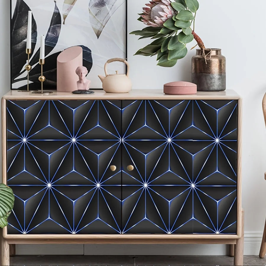 A wooden cabinet featuring a dark geometric pattern wallpaper with bright blue lines.