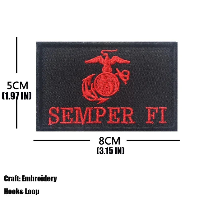 A black embroidered tactical patch featuring a red eagle design and the text SEMPER FI.