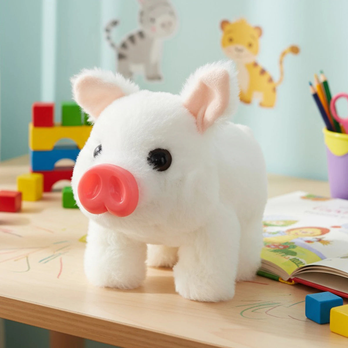 A white plush toy pig with pink features sitting on a wooden table next to colorful toys and books.
