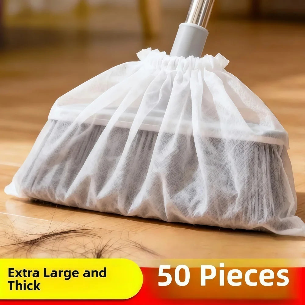 A white disposable electrostatic broom cover bag filled with light gray fibrous material.