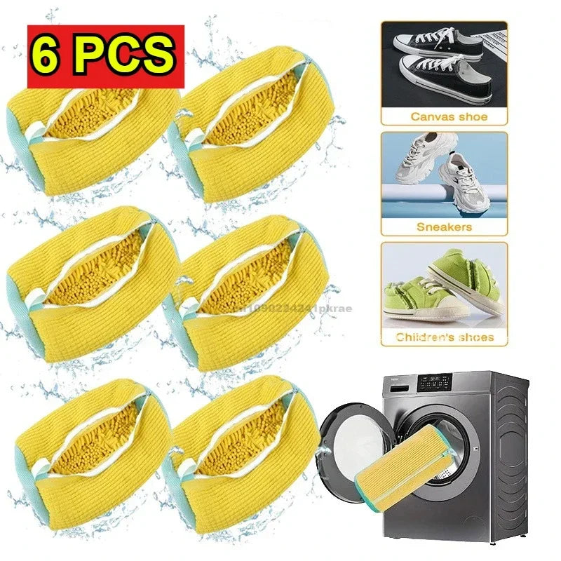 Six yellow canvas shoe laundry bags with mesh netting shown next to a washing machine.