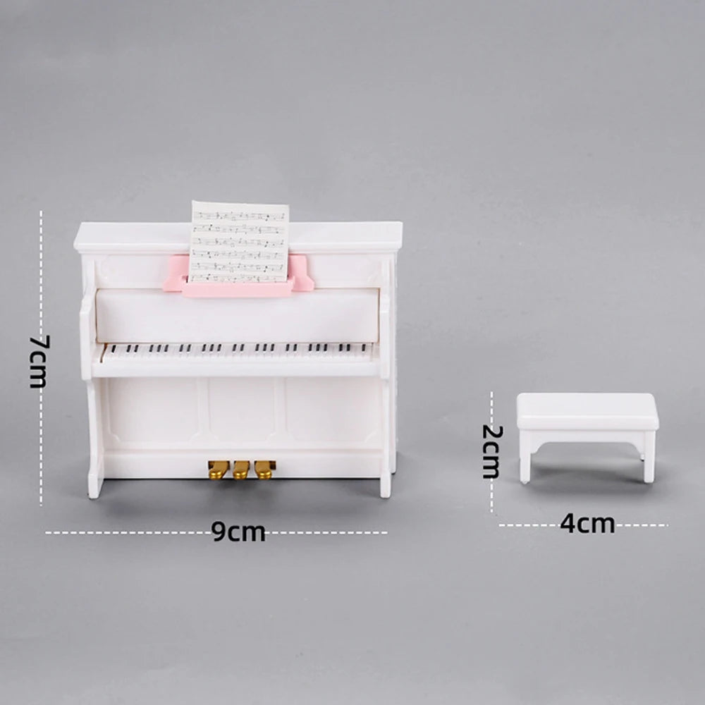 A white fashion doll accessories set featuring a piano-like structure and a small stool.