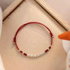 Bracelet en Fil Rouge Façonné à la Main