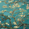 Close-up of a diamond painting depicting flowering branches against a teal sky.