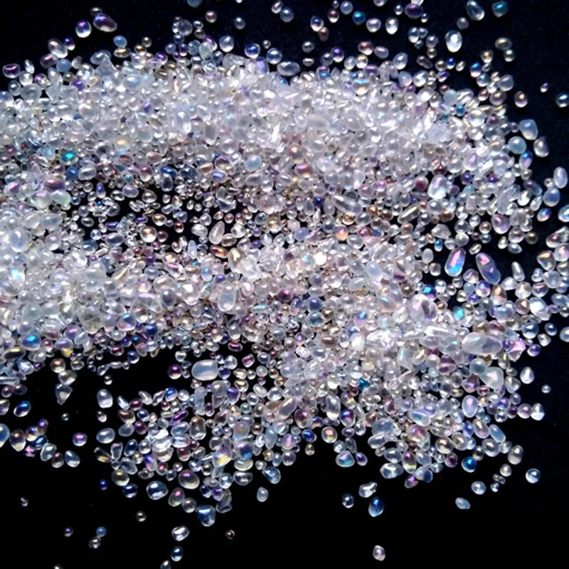 A close-up view of clear and iridescent decorative stone pebbles for terrariums and aquariums