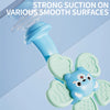 A blue baby suction cup spinning toy with animal shapes demonstrating strong suction on smooth surfaces.