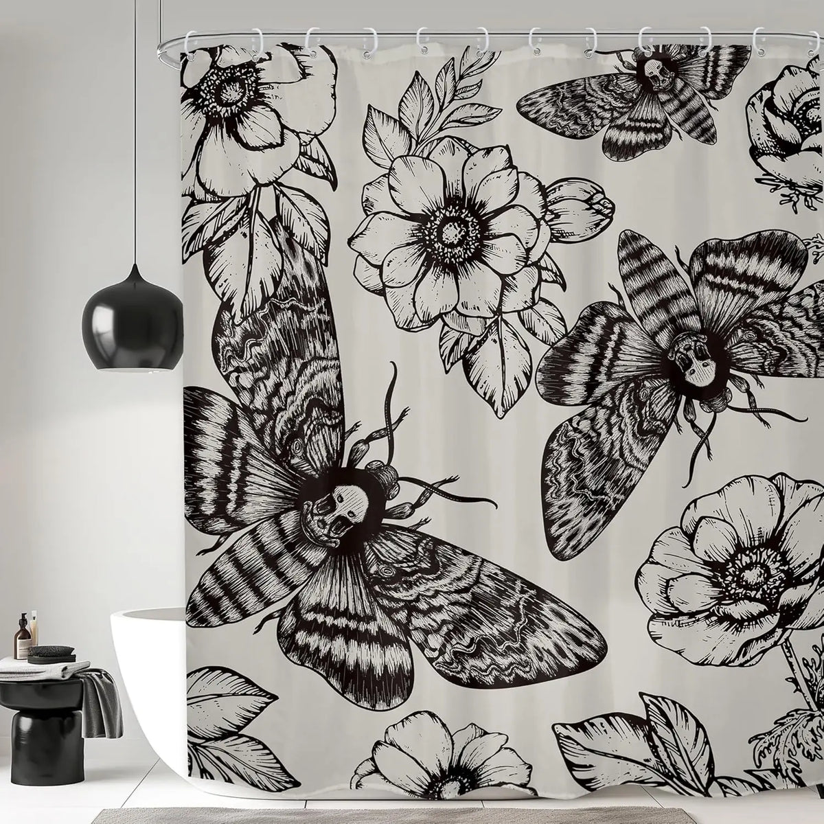 Gothic skull shower curtain featuring a black and white design of moths and floral patterns.