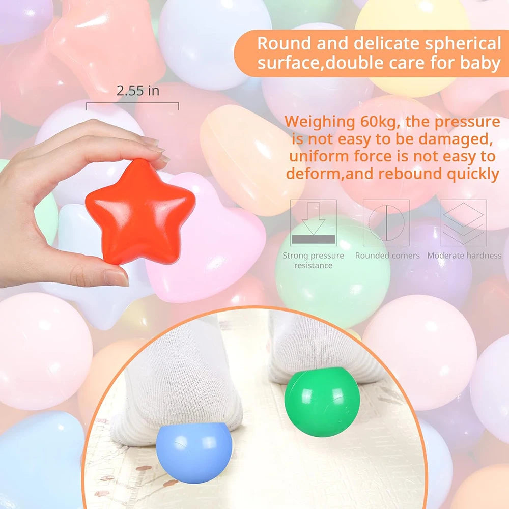 A hand holds a bright orange star-shaped ball next to various colorful, delicate spherical balls used for baby care.