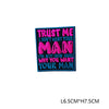 A dark blue embroidered patch with pink and yellow text that reads Trust me I don't want your man I'm not even sure why you w