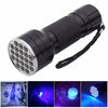 A black rechargeable UV flashlight with a textured grip and a circular light source, shown alongside examples of pet stains a