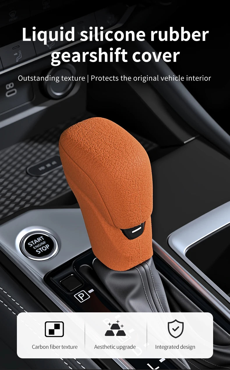 Orange liquid silicone rubber gearshift cover with carbon fiber texture and integrated design shown in a vehicle interior con