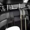 Black car headrest hooks with gold chains for hanging bags and organizers