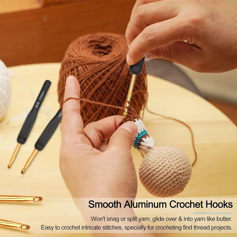 A hand is using a smooth aluminum crochet hook to work on yarn, demonstrating the ease of use for intricate stitching.