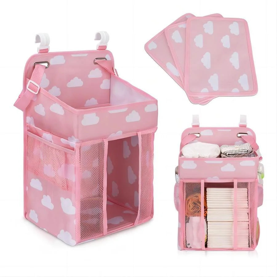 Pink hanging diaper storage organizer with mesh pockets for organizing baby supplies
