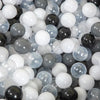 A close-up view of a large pack of colorful plastic ball pit balls in various shades of black, white, and translucent gray.