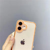 A hand holds an iPhone in a clear glow-in-the-dark neon orange case with a dark Apple logo.
