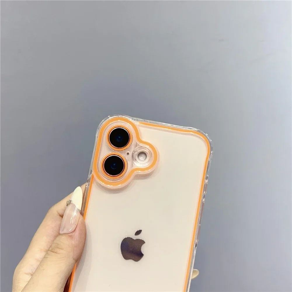 A hand holds an iPhone in a clear glow-in-the-dark neon orange case with a dark Apple logo.