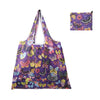A purple fabric reusable shopping tote bag featuring a vibrant pattern of colorful butterflies and floral designs.