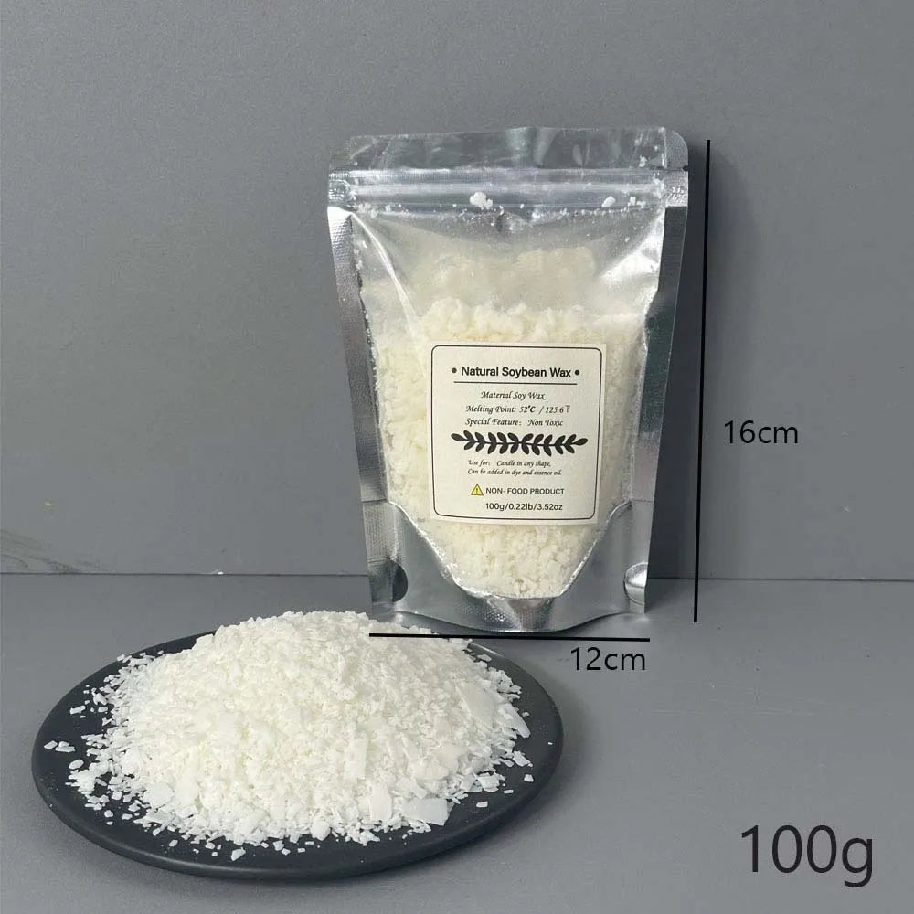 A clear plastic bag of natural soybean wax flakes next to a pile of white wax on a dark plate.
