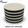 A set of five heavy cut black and white polishing wool pads with foam backing for scratch removal