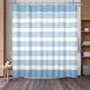 A light blue and white striped waffle weave shower curtain hanging on a rod.