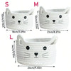Three sizes of white woven cotton rope storage baskets shaped like cats, labeled S, M, and L.