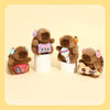 Three brown capybara plush toys with musical instruments are displayed on a light background.
